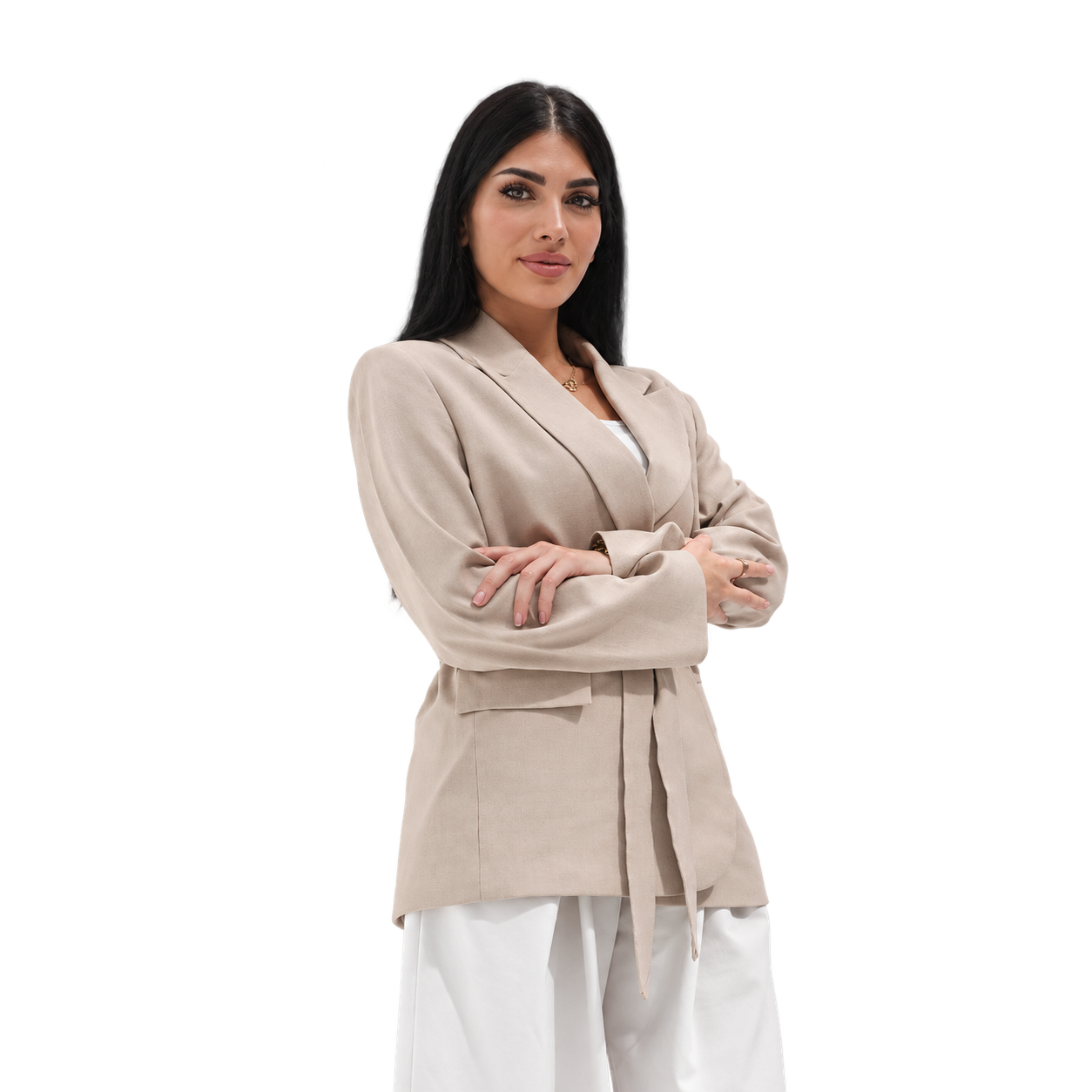 Diana in a beige belted blazer, arms folded